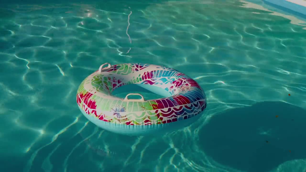 Custom pool with float ring on sunny day